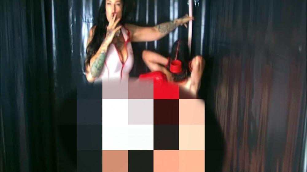 The Cruel Fetishfantasy of a Smoking Nurse in Red Overknee Boots